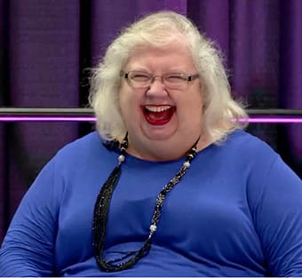 Liz Curtis Higgs laughs while being interviewed by Mark Taylor.